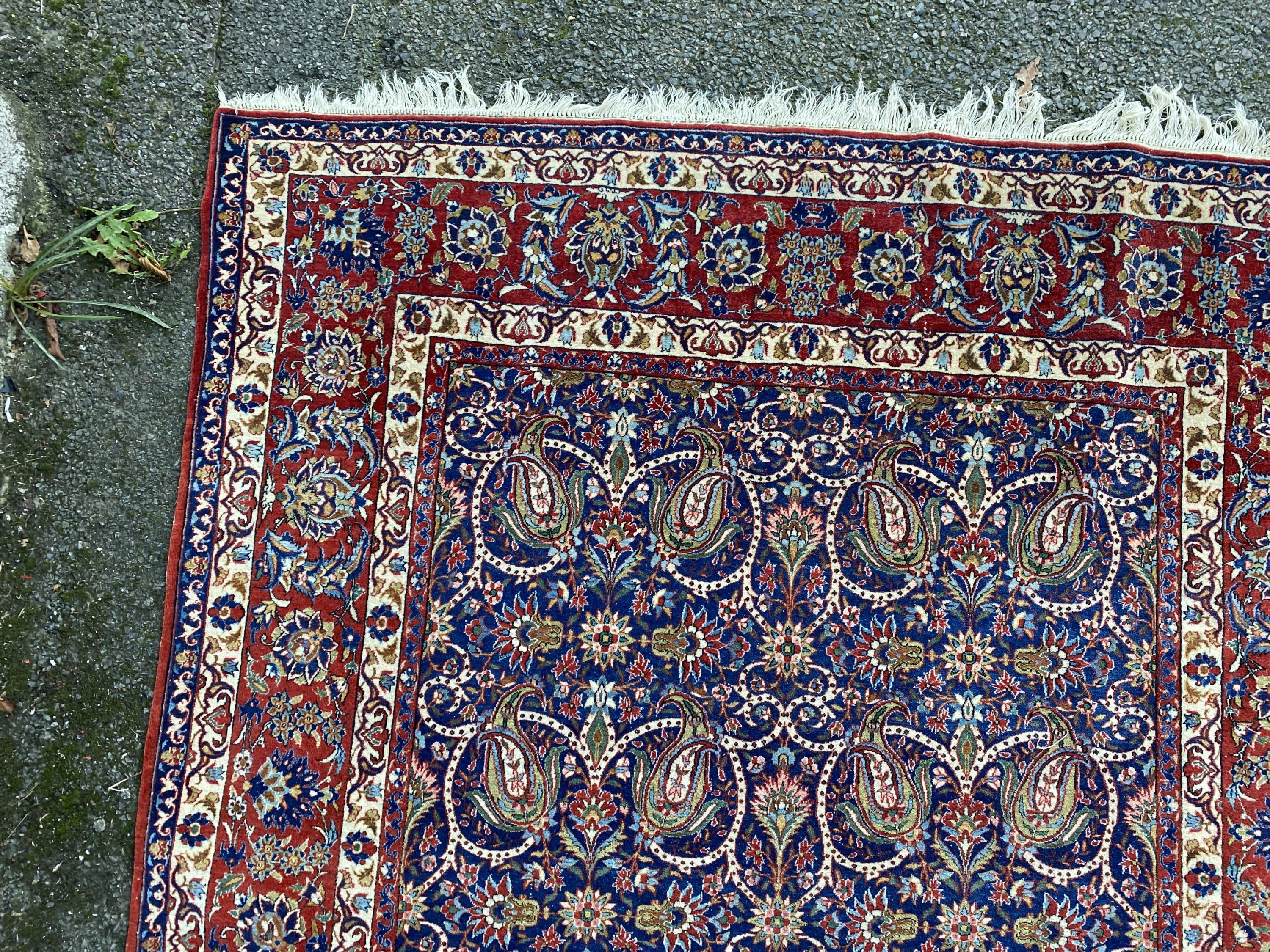 A Tabriz blue ground rug, first half 20th century, 225 cm x 155 cm